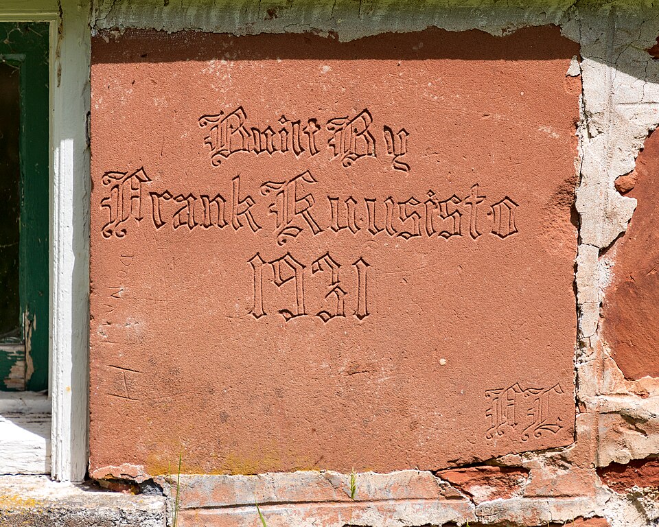 Carved sandstone cornerstone reading Built By Frank Kuusisto 1931