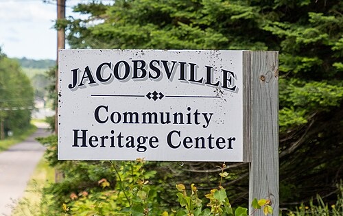 Wooden roadside sign reading Jacobsville Community Heritage Center, Houghton County, Michigan
